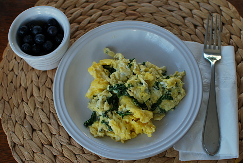 Breakfast for Dinner - scrambled eggs with kale and blueberries on the side