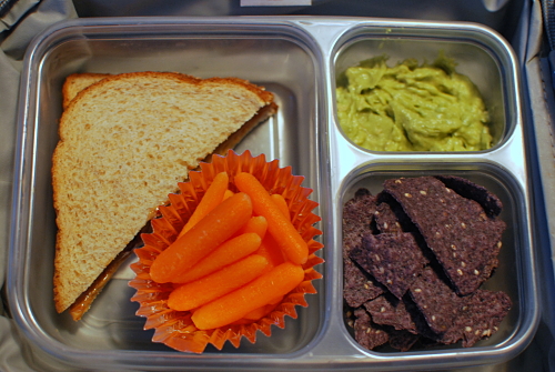 1/2 PB&J on whole wheat, baby carrots, organic blue tortilla chips and homemade guacamole.