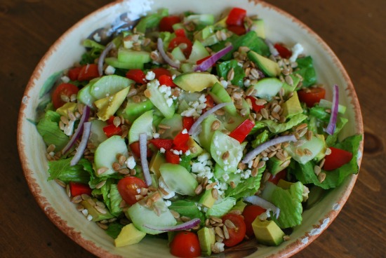 salad with cuke, red pepper, tomato, avocado, sunflower seeds, feta