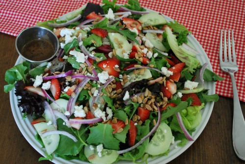 salad with strawberries goat cheese red onion sunflower seeds